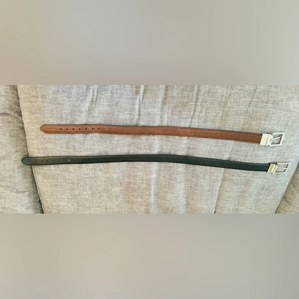 A set of two boys belts: Dockers (size 22-24) and Nautica (size 28).